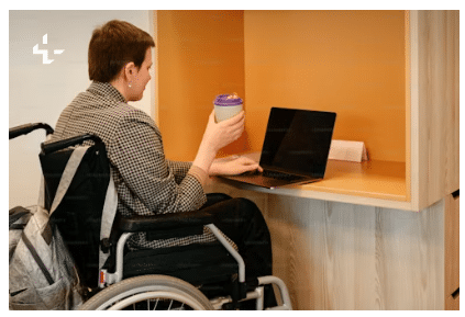 Woman on a wheelchair browsing the internet.